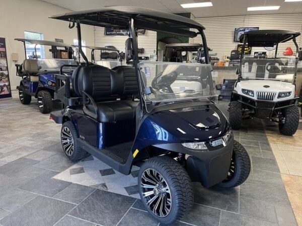 Side profile of 2024 E-Z-GO Freedom RXV ELiTE Lithium Patriot Blue in Detroit Michigan