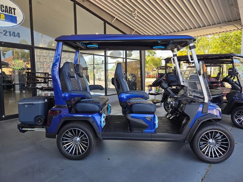 Side profile of 2025 Evolution D-Max GT4 Blue golf cart available in Illinois with export and nationwide delivery