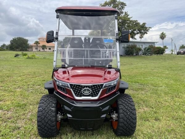 Side profile of 2025 Evolution D-Max XT4 electric vehicle in red available in Texas