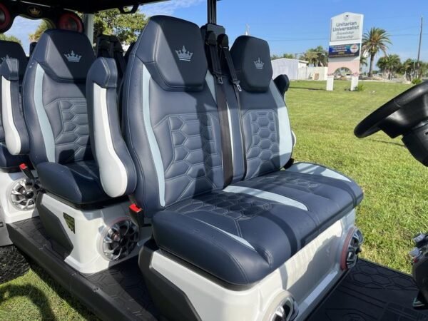 Side profile of 2025 Evolution D-Max XT6 white golf cart available in Michigan with nationwide delivery and export