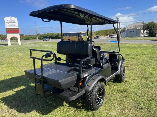Dashboard interior of 2025 Evolution Forester 4 Plus black golf cart available in Tennessee