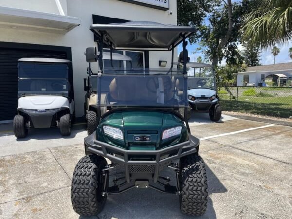Side view of 2026 Club Car Onward Lifted 4 Passenger Gas green golf cart in Arizona