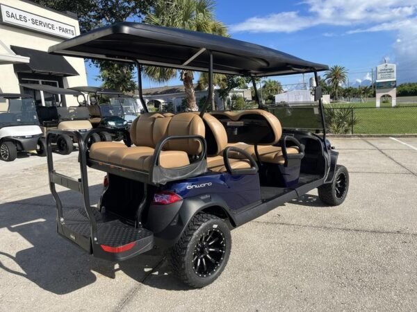 Side view of 2026 Club Car Onward Lifted 6 Passenger Gas blue golf cart in Michigan