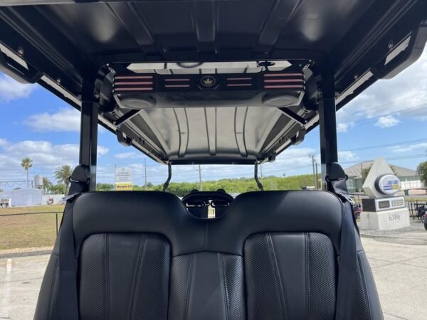 Rear angle of 2025 Evolution D5 Maverick 4+2 Plus golf cart