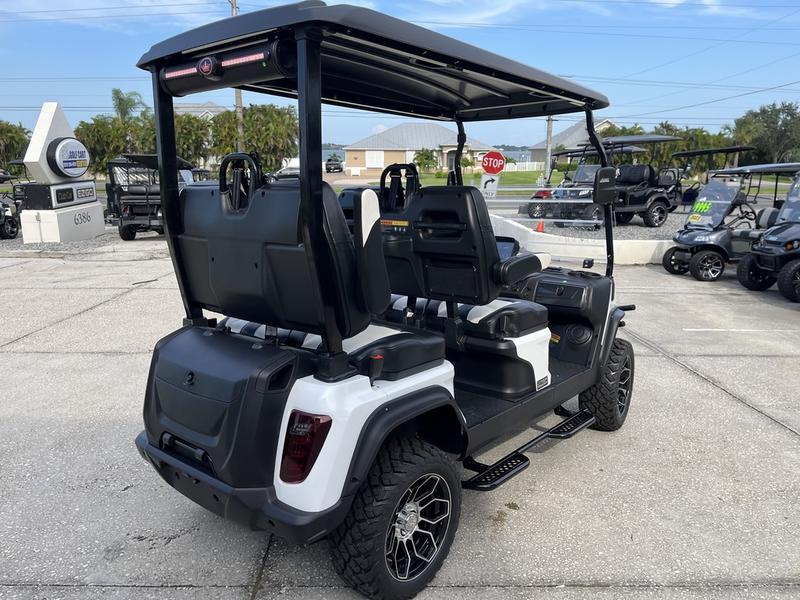 Street-legal 2025 Evolution D5-Maverick 4 golf cart on road