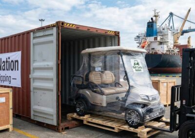 Loading a shipping container with golf carts for international export from NYC.