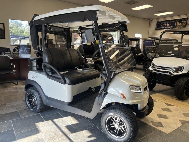 White Club Car Onward 2 Passenger golf cart in a showroom