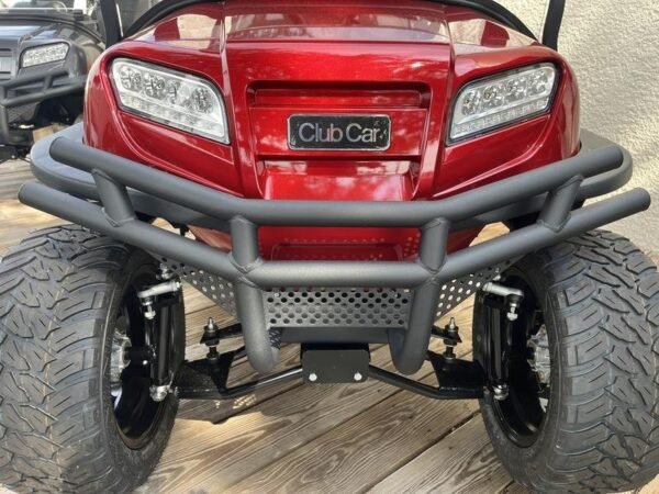 Front of the red Club Car Onward Lifted 4 Passenger with brush guard