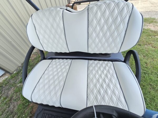 Gray diamond-stitched seats in the Club Car Onward