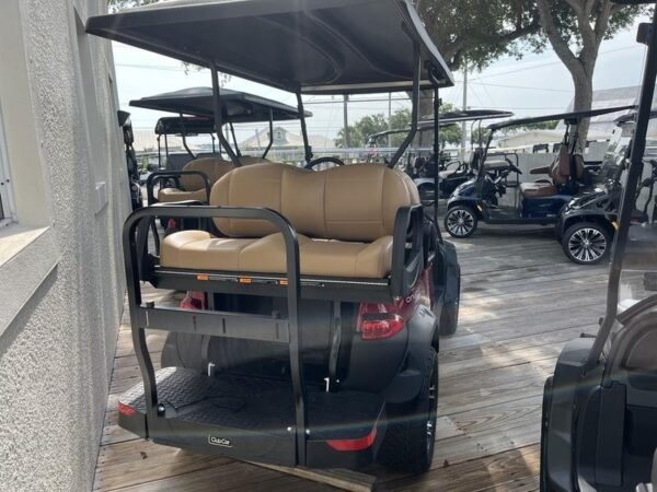 Tan rear-facing back seat on the Club Car Onward Lifted 4 Passenger