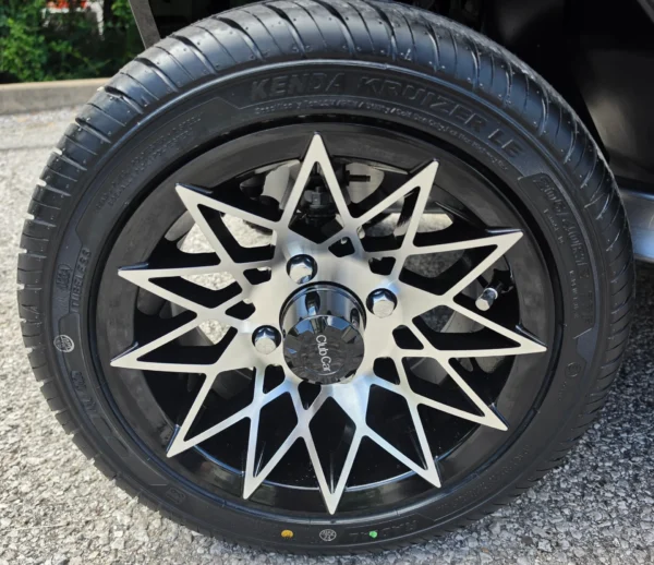 Black and silver alloy wheel on the Club Car Onward