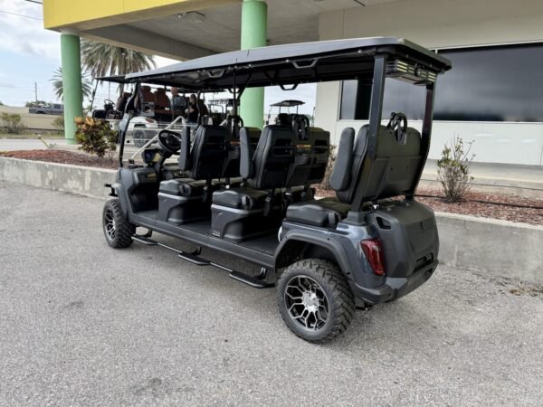 Evolution D5 Maverick 6 rear side view with running boards and aluminum wheels