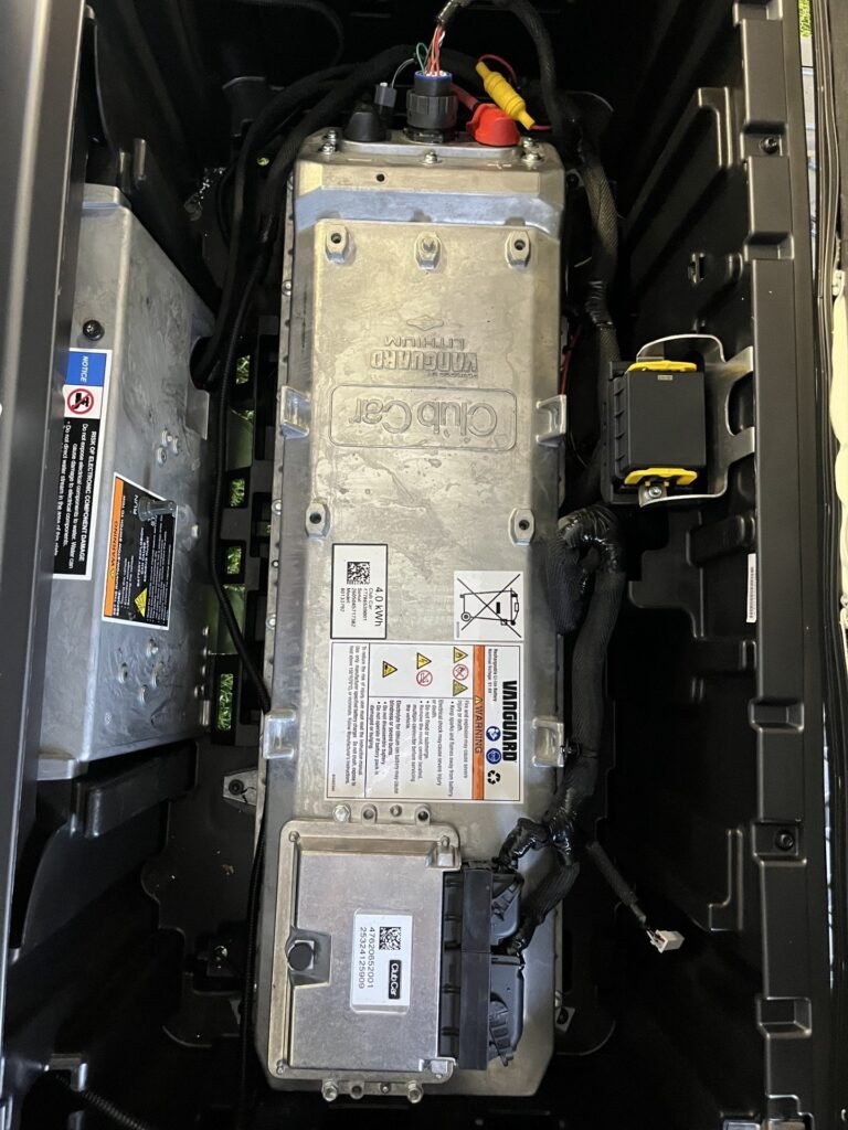 Battery and electronics compartment under the seat of a Club Car Onward 4 Passenger